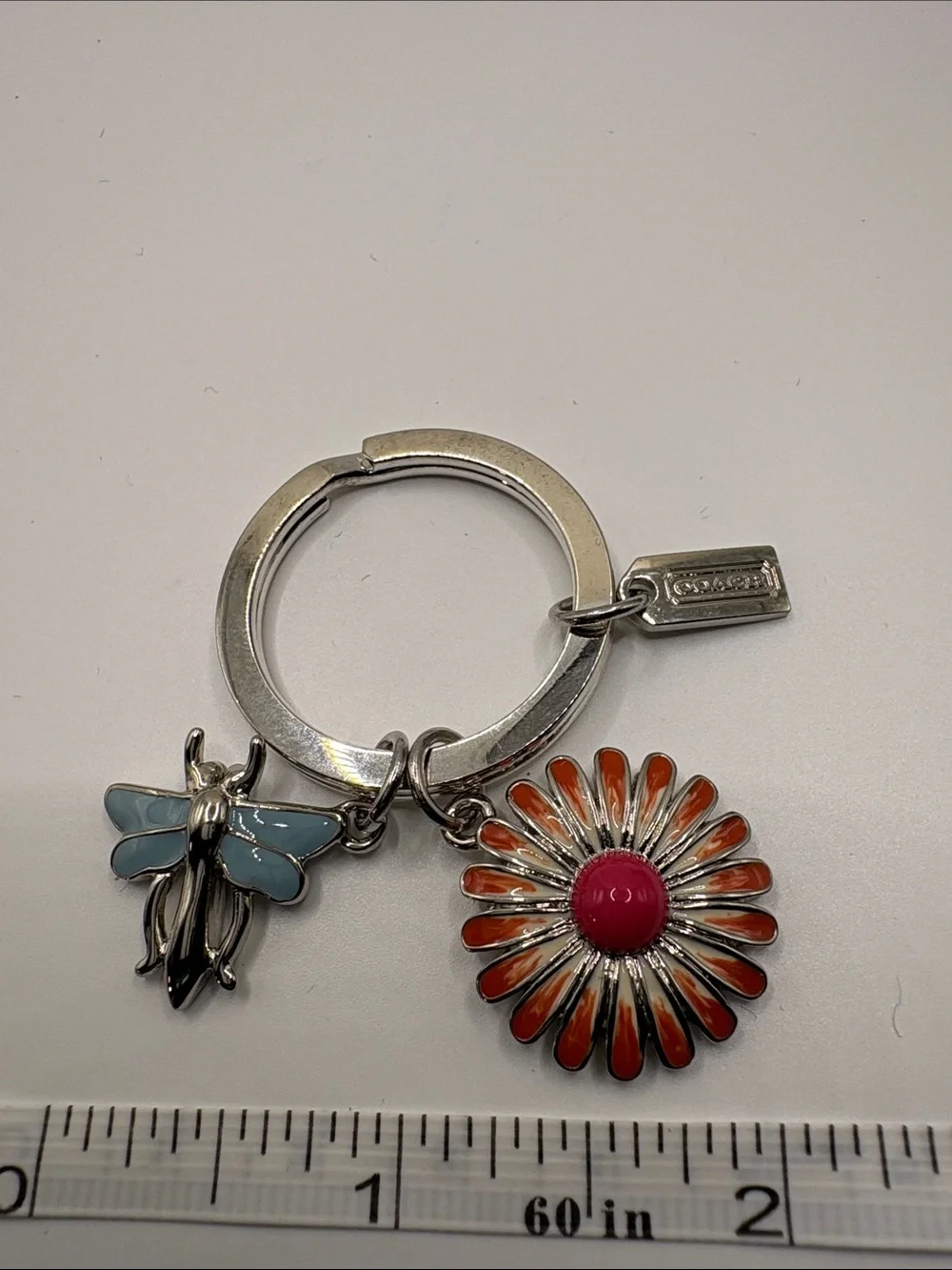 Coach Silver Key Ring with Orange Daisy and Light Blue dragonfly Charms